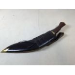 A Kukri knife in scabbard H:46cm