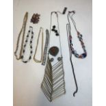 J9. A collection of costume jewellery including a Monet necklaces and a necklace marked Christian