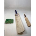 A signed cricket bat from Surrey Cricket Club together with a miniature signed bat and an