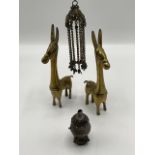 A pair of brass donkeys with elongated necks, and a Burmese silver pendant incense burner. H:23cm