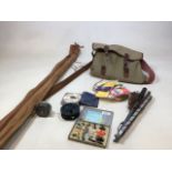 Fishing interest. Two vintage fishing rods in canvas rod bags, also with a canvas fishing bag with