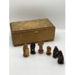 A Bavarian carved wooden chess set with churches etc, in a carved box. Circa 1950 - complete. King