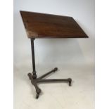 A Carters London early 20th century adjustable reading table on metal base with metal castors. Top