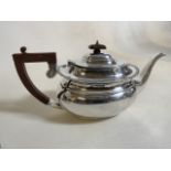 A silver tea pot with Bakelite handle and lid. Total weight 644 grams.