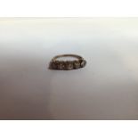 Five diamond ring on gold band - no hall mark, total weight 2 gm. Size 7. Width of largest diamond