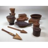 A group of artefacts, comprising two North African leather pots with lids, 3 Fijian oval fruit