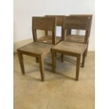Four 20th century oak dining chairs with shaped seats. Seat height H:45cm