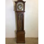 A West German Twentieth Century Grandmother clock with silvered metal face and bevelled glass W:38cm