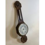 An oak glazed aneroid barometer and thermometer, early 20th century. H:79cm