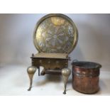 A brass two handled fireside footman stool also with a large Islamic design charger and a copper