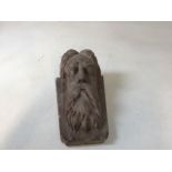 A Portland stone wall bracket of a bearded man W:19cm x D:17cm x H:28cm