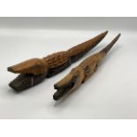 Two North African carved ebony crocodiles. Sudan region, circa 1980. (8) length 48 cm.