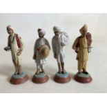 Four Indian raj clay painted figures. H:11cm