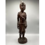 A large African (Sierra Leone) carved hardwood figure of a tribal warrior. H:68cm