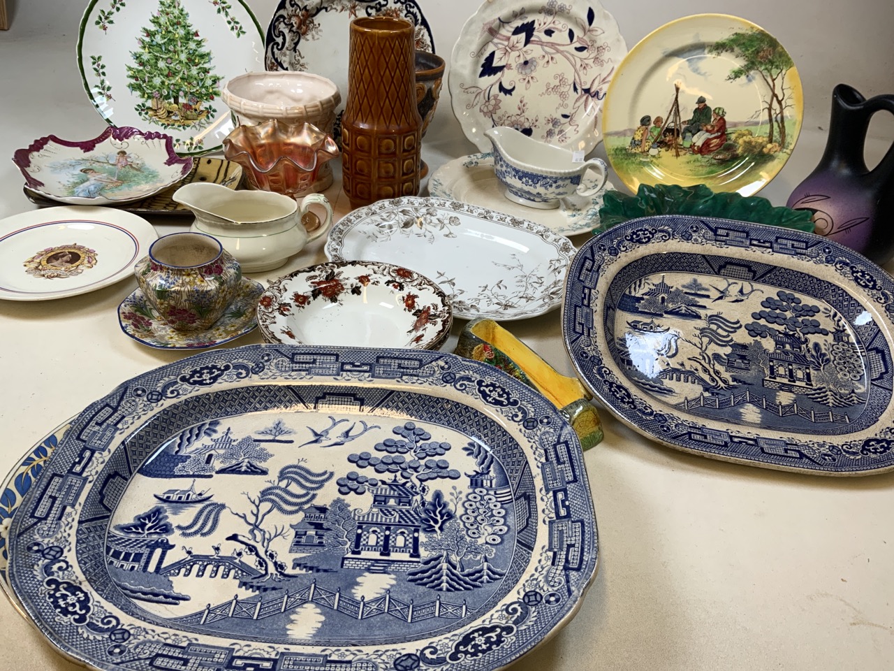 A quantity of ceramics including meat platters, plates, vases and other items