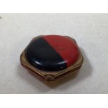 A red and black 1930s deco compact. Labelled Club Leviathan. A souvenir from SS Leviathan Ocean