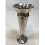 A silver hallmarked vase with weighted base. Hallmarked W&H W:9cm x H:20cm