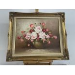 A 20th century floral oil on canvas in period frame, signed L.Johnson lower right. Frame size W:65cm