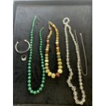 A malachite necklace length 65:cm with a cut glass necklace a graduated stone necklace etc.