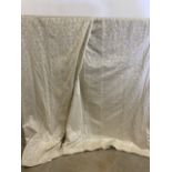 A pair of very long cream woven jacquard curtains. W:250cm x H:270cm