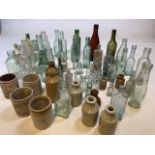 A quantity of glass and stoneware bottle dump finds