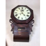 A wall clock with cased pendulum, marked on face GWR. W:42cm x D:10cm x H:65cm