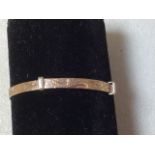 A 9 carat gold babys christening bangle - approx weight 3gm