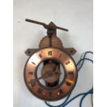 A vintage wooden weight driven clock Swiss made by Baumann Ltd