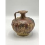 An Italian Apulian (Gnathian) black glazed terracotta flask, circa 330-300 BC, the globular lobed