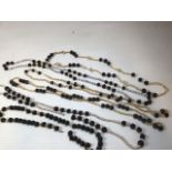 Six Fijian shell and black ball nut necklaces.
