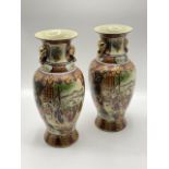 A pair of Chinese Imari pattern porcelain vases. Circa 1920-1940.. (32) H:36cm