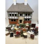 A large dolls house with furniture.