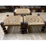 A set of three traditional Sudanese square shaped low stools. with woven rush seats. On heavy,
