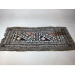 A Fijian or Tongan ceremonial Tapa panel, white geometric patterns presented on a mulberry bark