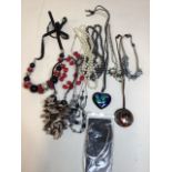 A quantity of costume jewellery necklaces, including an Indian heart-shaped pendant with turquoise
