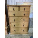 A tall solid pine chest of drawers with two short over three long drawers. W:92cm x D:52cm x H: