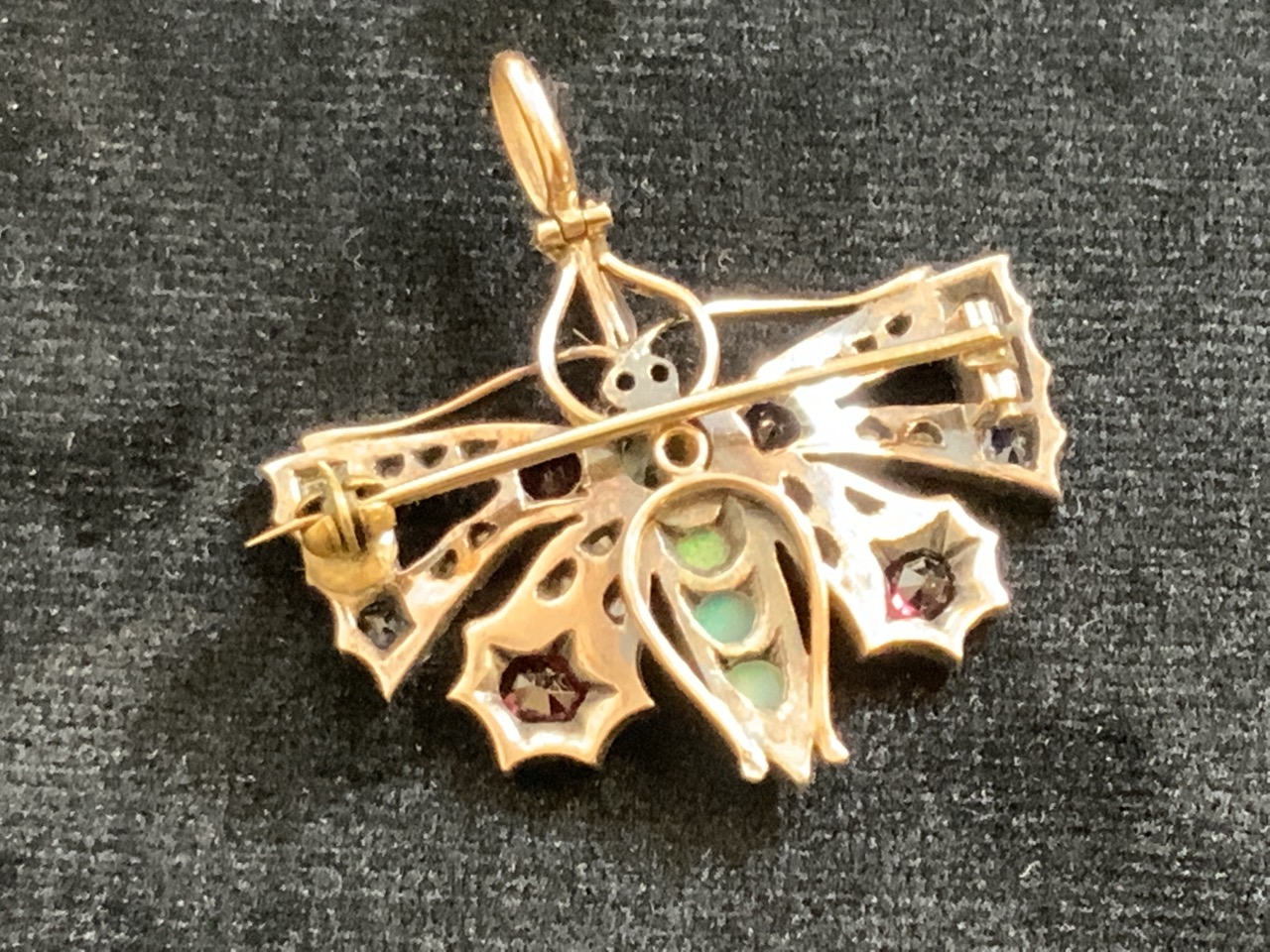 A gold 1920 30’s Butterfly brooch pendent, un-hallmarked set opals, rubies, sapphires and diamonds. - Bild 3 aus 6