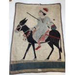 An Eastern wall hanging needlework of an donkey and rider. W:67cm x H:92cm