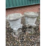 A pair of reconstituted stone garden urns. H:52cm