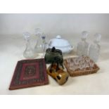 A quantity of glassware including 2 glass handbags, 4 decanters and other items