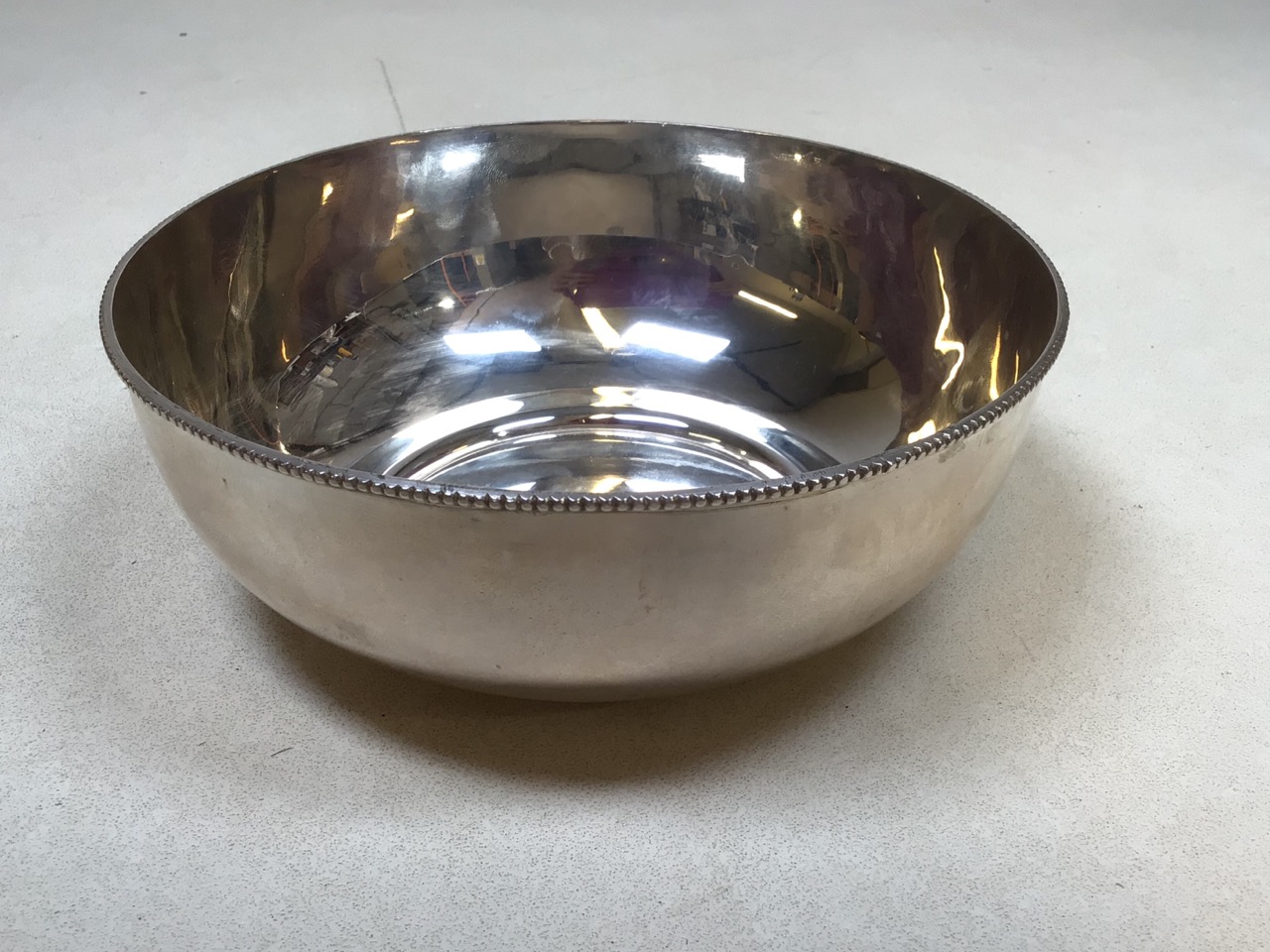 A white metal bowl stamped silver to base. Weight 209 gm W:17.5cm x H:7cm