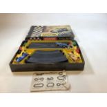 A vintage boxed Scalextric set - Grand Prix Series. Box is play worn and has repairs .