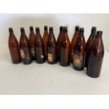 Twelve Taunton vintage cider bottles.