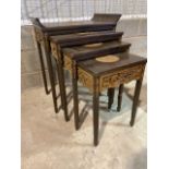 An Oriental nest of four tables with carved details Largest W:65cm x D:39cm x H:75cm