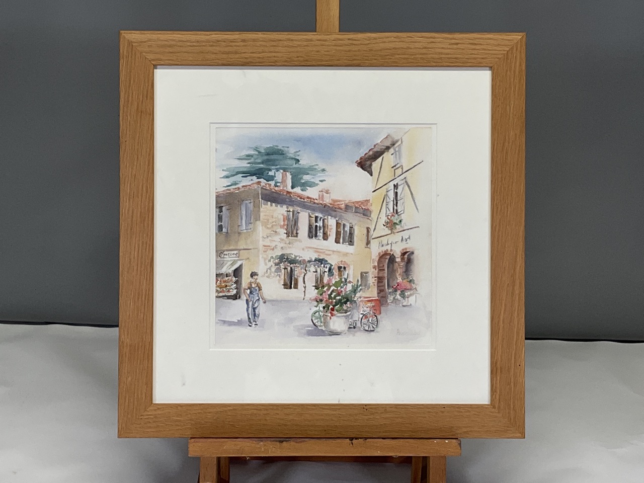Framed Continental school watercolour of a European village square scene. Signed by Annie Cabot. - Image 2 of 5
