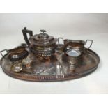 Silver plated tee set on tray with other items including Christophle sugar nips