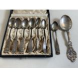 A cased set of Continental 830 silver teaspoons together with a another spoon. Total weight 134