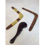 Two boomerang, a carved MÄori fighting club and a Marakihau carving H:29cm Club