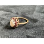 9ct gold opal ring set with pink stones. Ring size Q