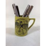 Five Parker pens in a Portmeirion mug